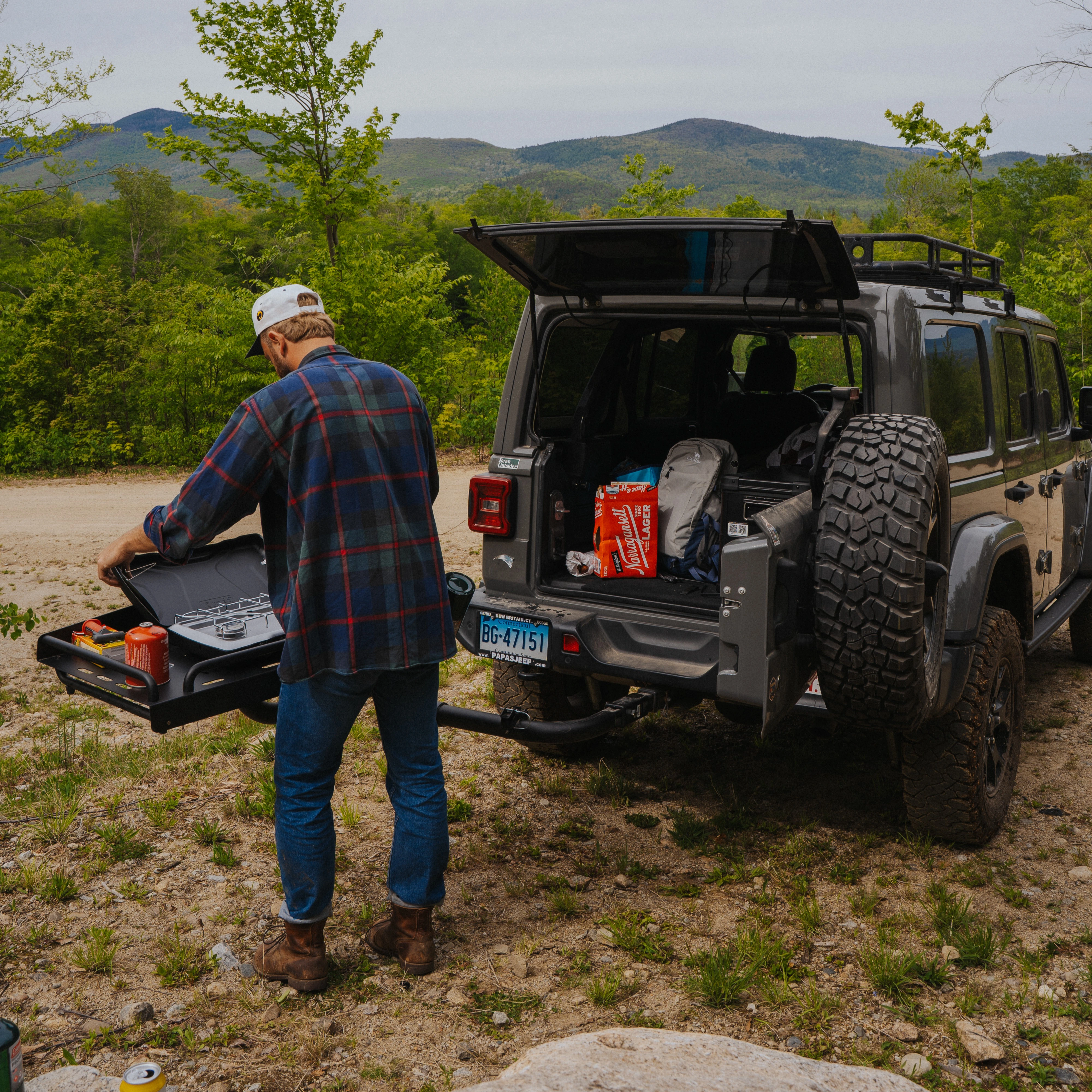 Overland rig with rooftop tent on a dusty trail